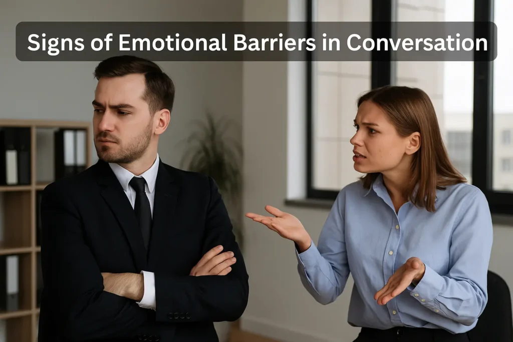 image of two colleagues: one with arms crossed and looking away, the other appearing frustrated, illustrating nonverbal cues of emotional barriers in professional communication.